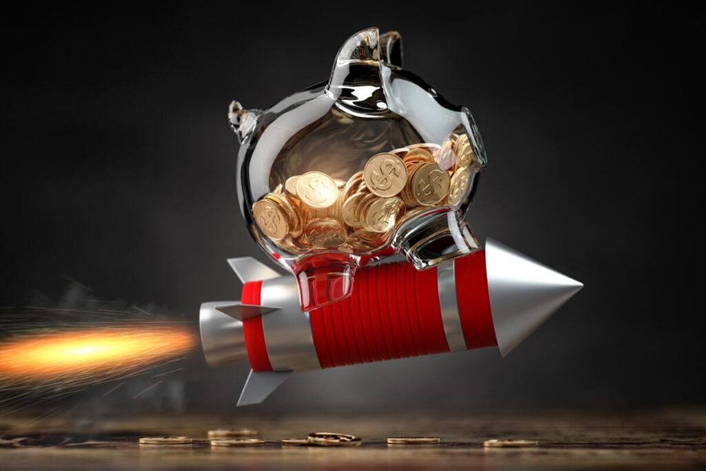 Piggy bank on a flying rocket
