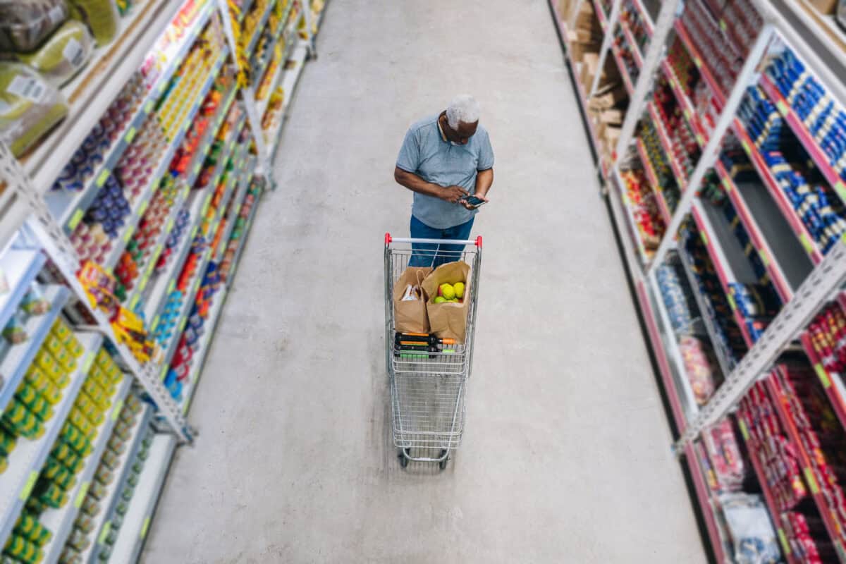 man shops at grocery store